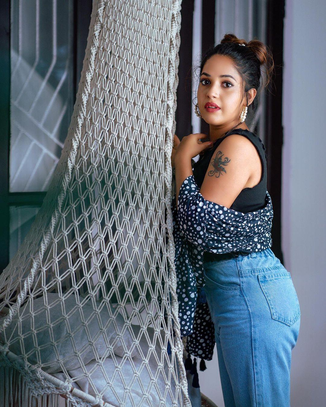 Beautiful and cute stills | Amrutha Nair in sleeveless and exposing hot photoshoot