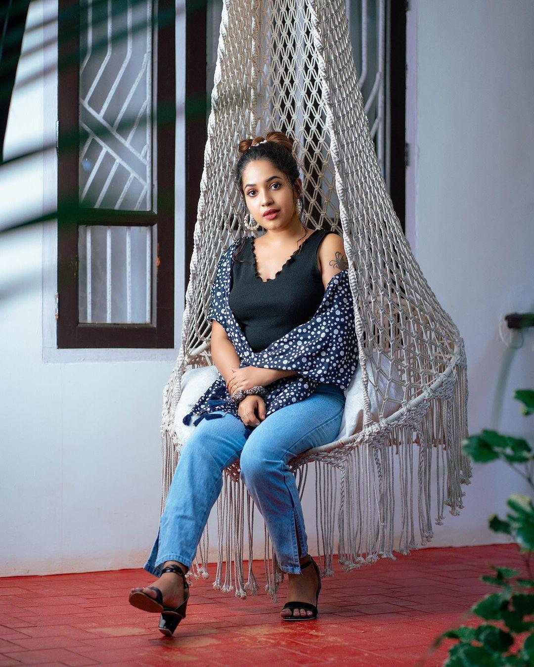 Glamorous and cute stills | Amrutha Nair in sleeveless and exposing hot photoshoot