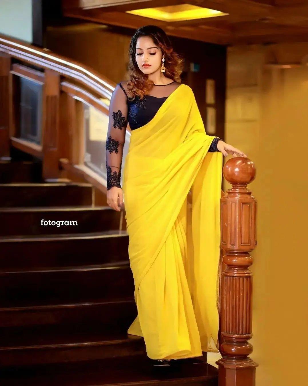 Exposing hot photos gallery | Malavika Menon in yellow transparent saree hot and sexy photoshoot