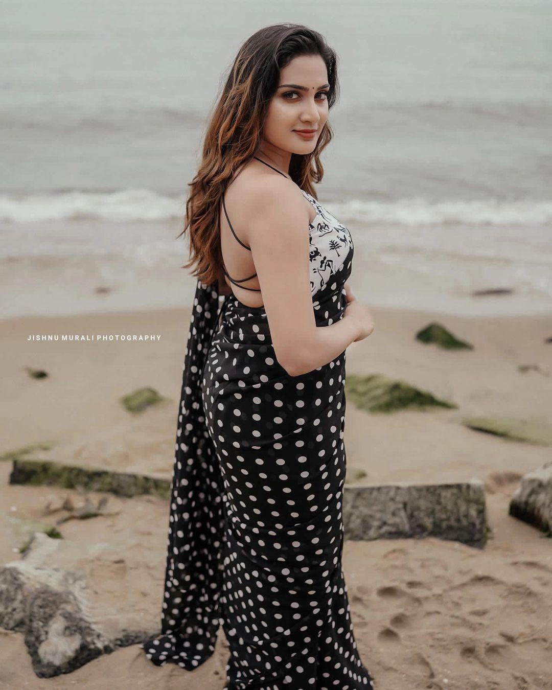 Glamorous and cute stills | Aditi Ravi wearing backless blouse and sexy photoshoot