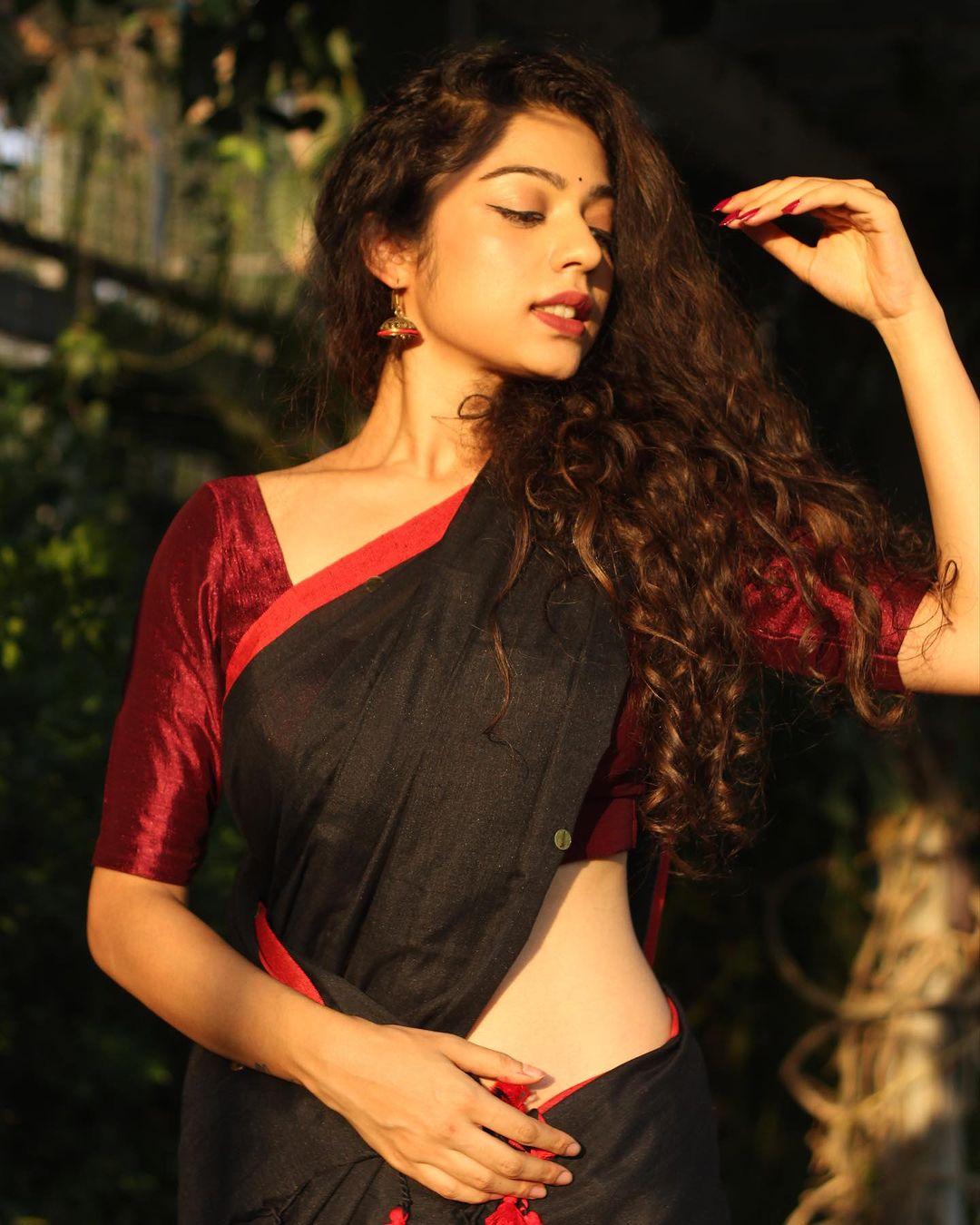 Varsha Bollamma in a black saree exclusive hot photos